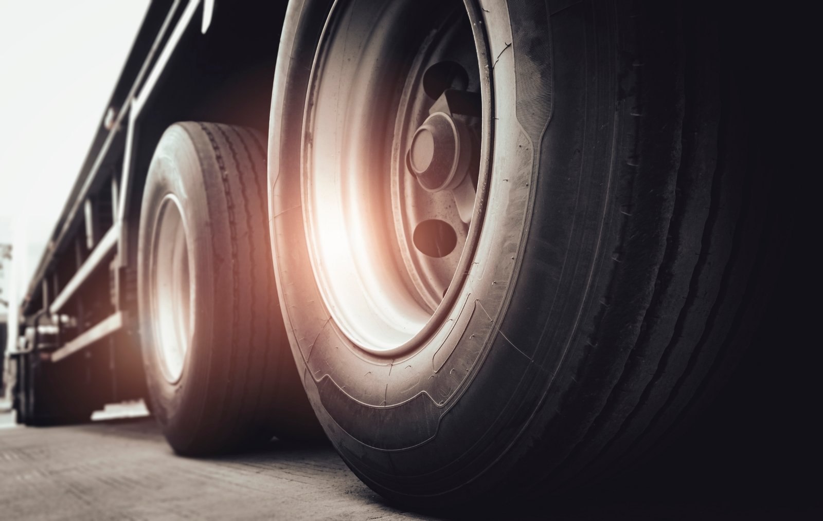 Freight Transportation. Close Up Large A Truck Wheels And Tires Of Semi Truck.